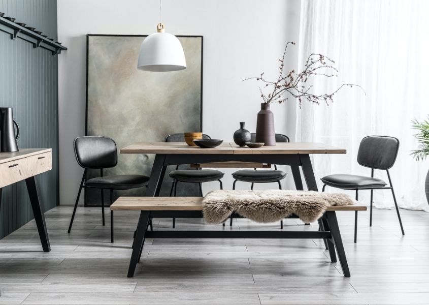 modern dining table with matching wooden bench and faux leather dining chairs