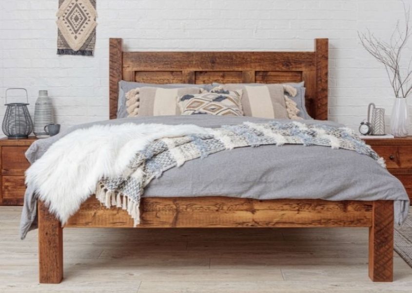 rustic wooden bed frame with grey covers