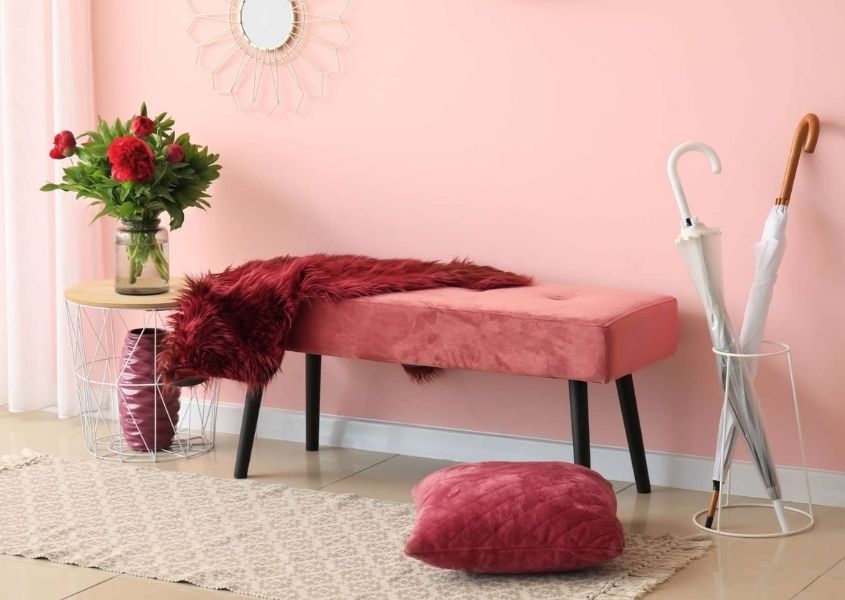 Pink fabric bench with umbrella and bright pink cushion