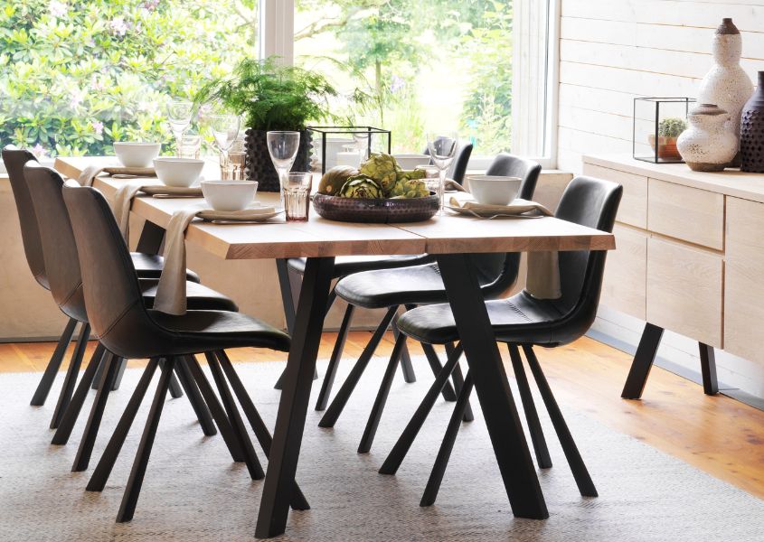 industrial style dining table with brown faux leather dining chairs