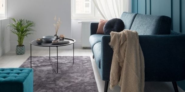 Dark blue sofa with round coffee table