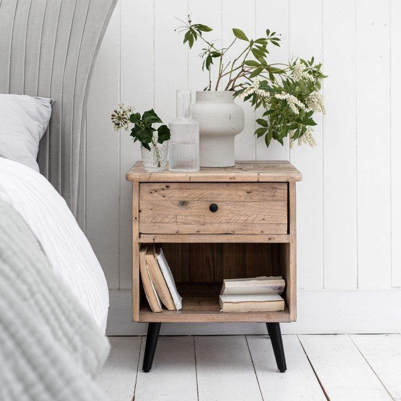 wooden bedside table with drawer and shelf and plant on top