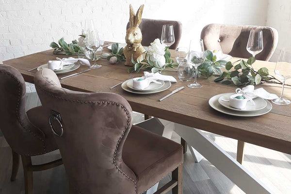 Oak Dining Table Set for Easter with Velvet Chairs and White Napkins