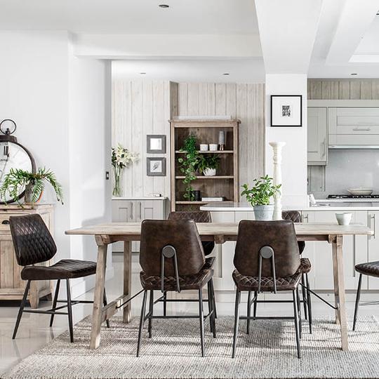 Industrial dining chairs with pale wooden dining table