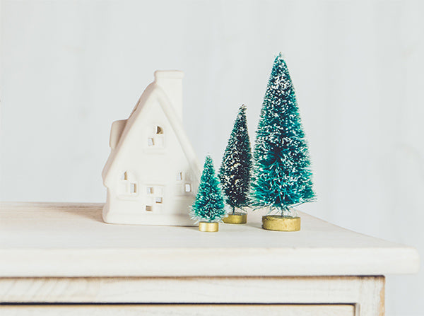 Artificial Christmas Trees on Sideboard