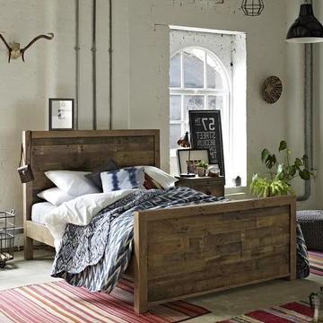 Reclaimed wood bed with high headboard