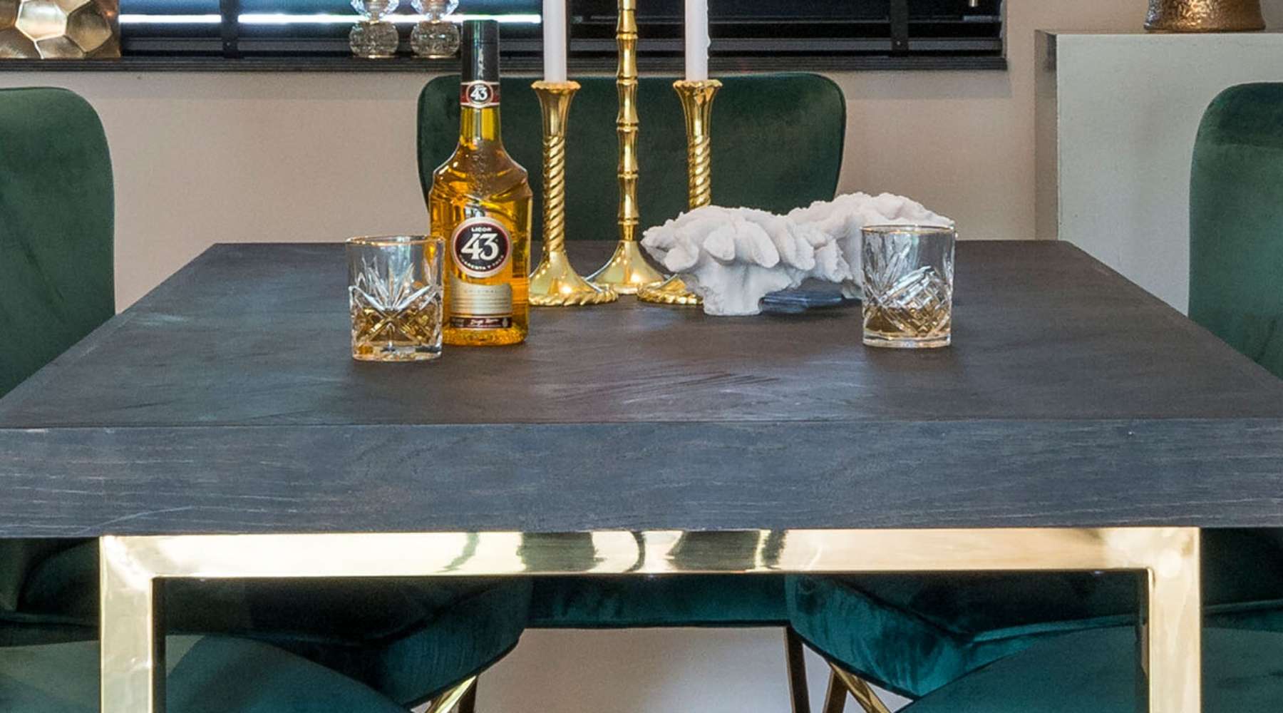 wood dining table with gold candlesticks