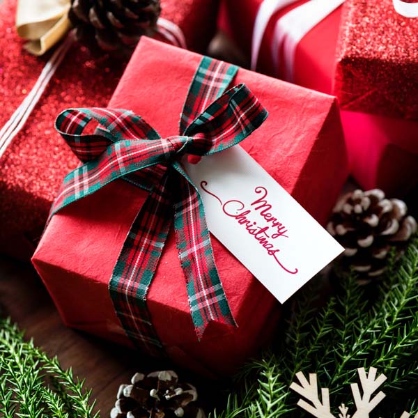 Christmas Gifts in Red Wrapping Paper