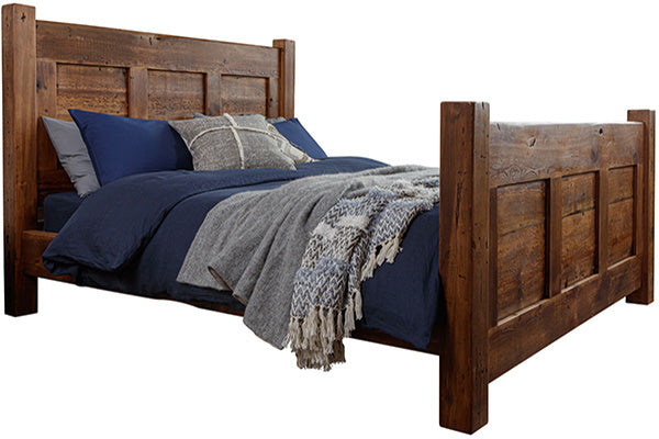 A reclaimed wood bed with blue and grey bedding