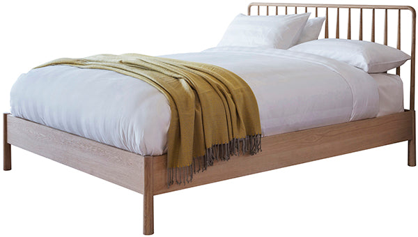 Light oak Scandi wood bed frame with a yellow throw