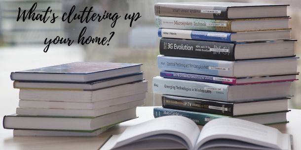 Pile of books with what's cluttering up your home writing