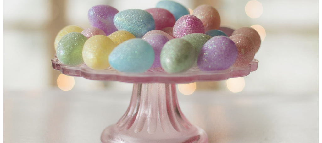 Multicoloured painted eggs on cake stand