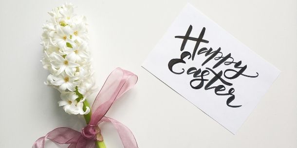White hyacinth and card with handwritten Happy Easter