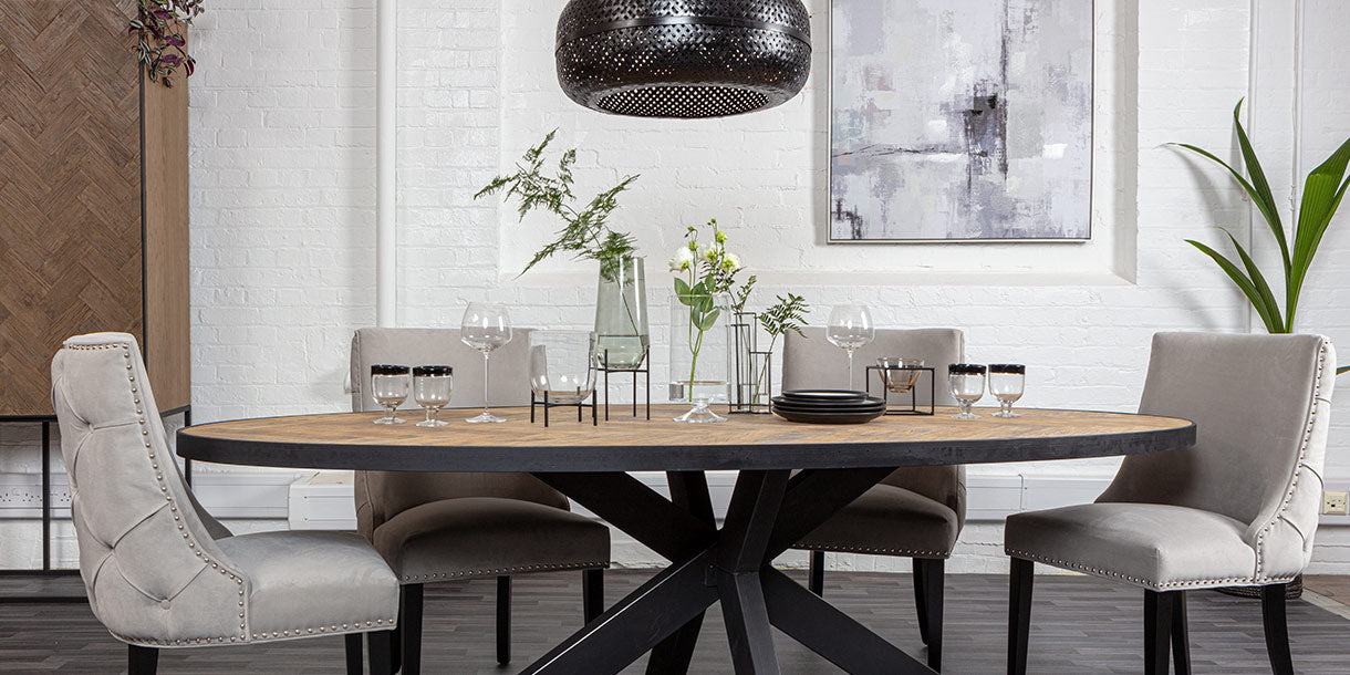Luxe dining room with light grey button back dining chairs