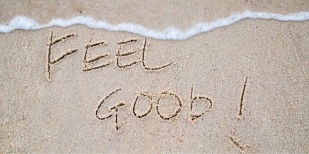 Feel Good written in the sand
