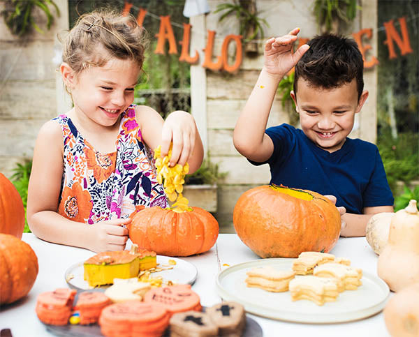 Halloween with Children and Pumpkins