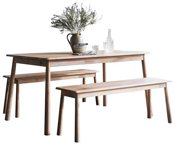 A Scandi style dining table with matching benches made of light oak