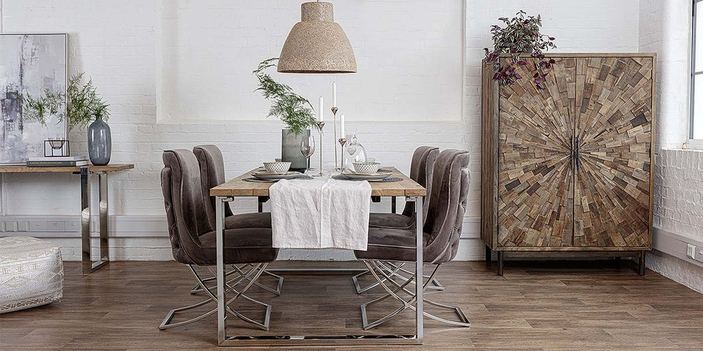 Luxurious dining room with reclaimed wood furniture and natural earthy finishes in the decor