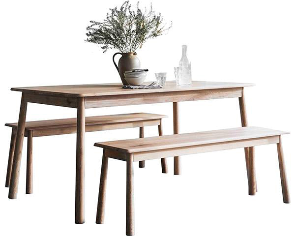A Scandi style oak dining table with matching benches