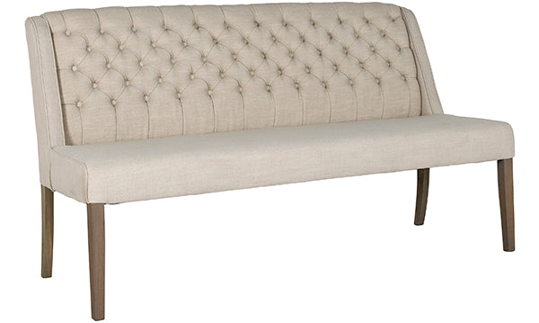 A large upholstered dining bench on wooden legs