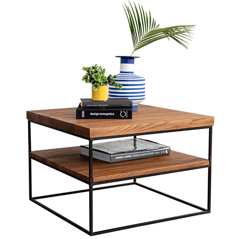 An Industrial style Oak Side Table with a plant and a vase on top