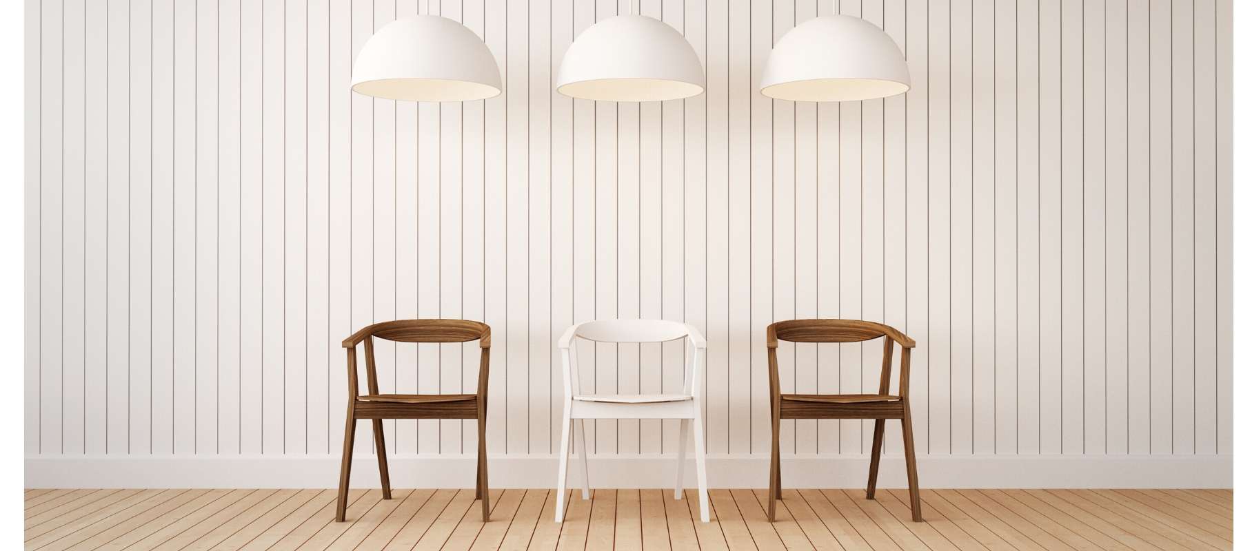 Wooden dining chairs with three white kitchen pendant lights