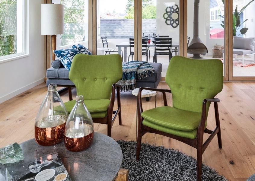 green armchairs and coffee table in a living room