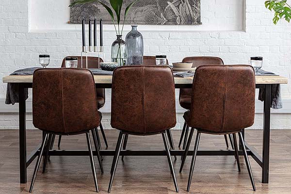 Industrial style oak dining table on steel legs with industrial dining chairs