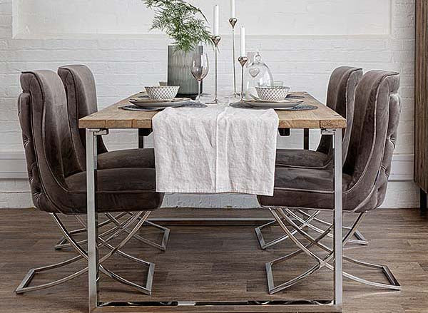 Luxurious reclaimed elm dining table with taupe velvet dining chairs