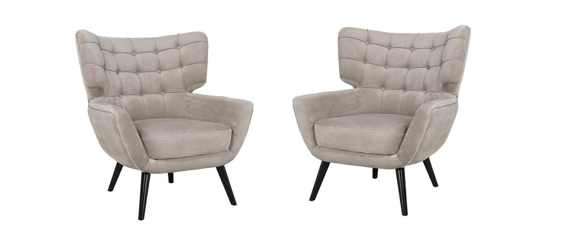 Two velvet winged back armchairs in cream fabric