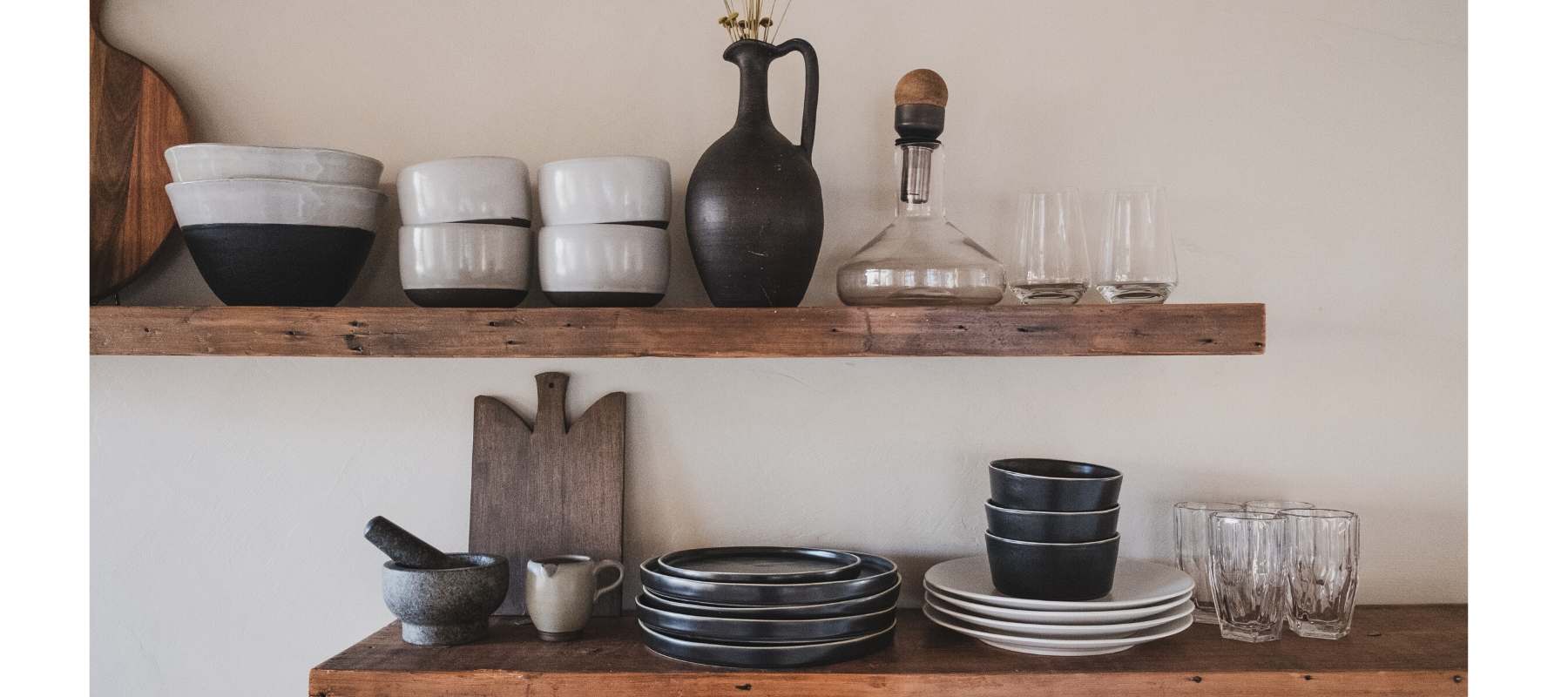 Rustic wooden kitchen shelves with pots and vases