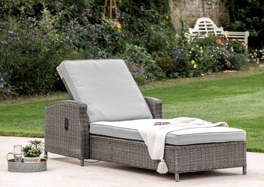 rattan sun lounger with white cushion