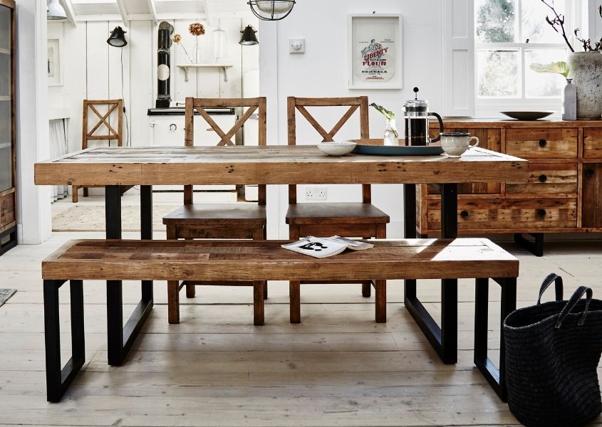 Industrial dining table with matching bench and wooden dining chairs