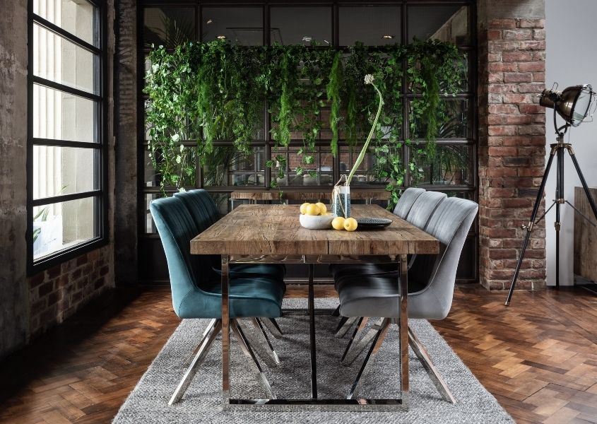 Rustic industrial dining table with velvet dining chairs