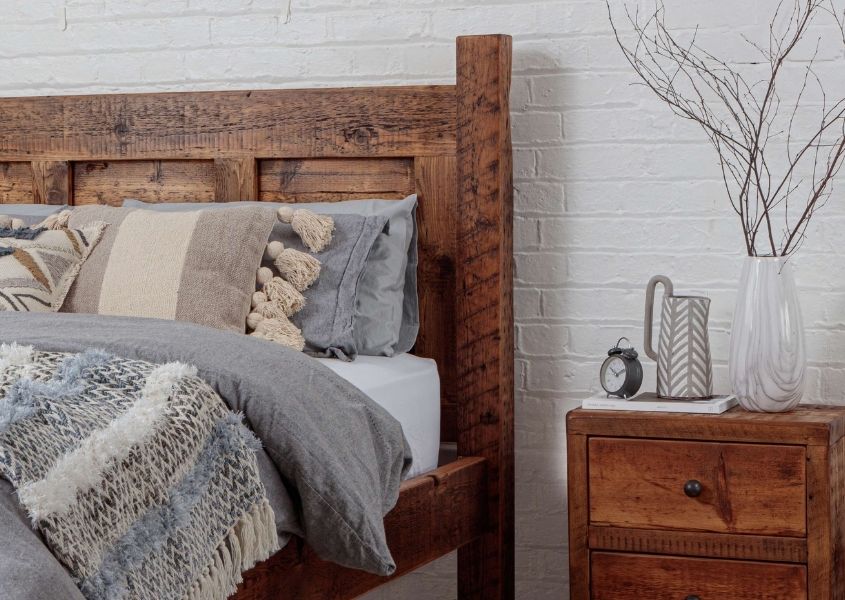 Wooden bed with rustic bedside table