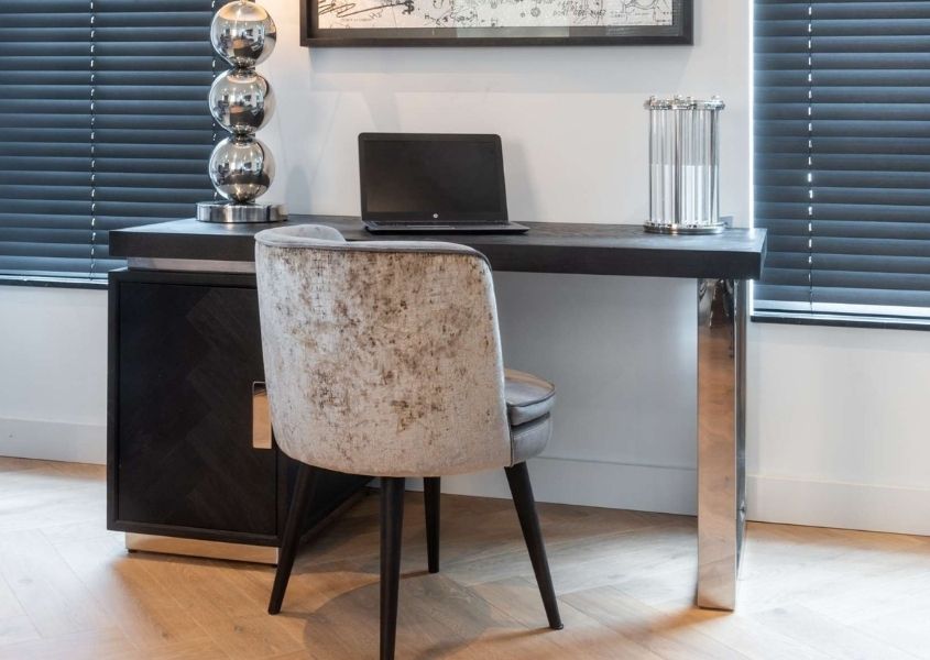 Black wooden desk with silver frame and legs with silver fabric office chair