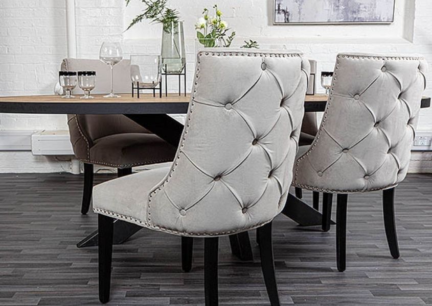 Back buttoned grey velvet armchairs with black wooden legs