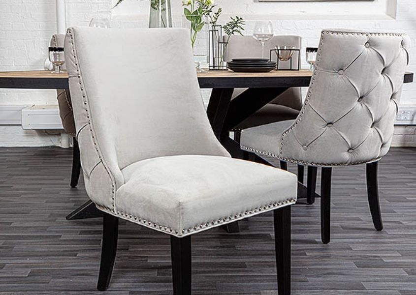Grey velvet dining chairs with buttoned back