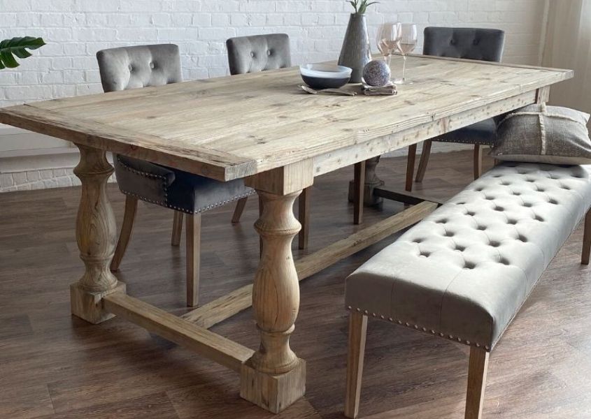Rustic dining table with refectory style legs with grey velvet buttoned dining bench