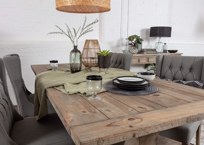 Reclaimed wood dining table and grey fabric dining chairs