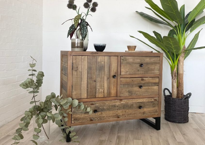 reclaimed wood sideboard with green house plants