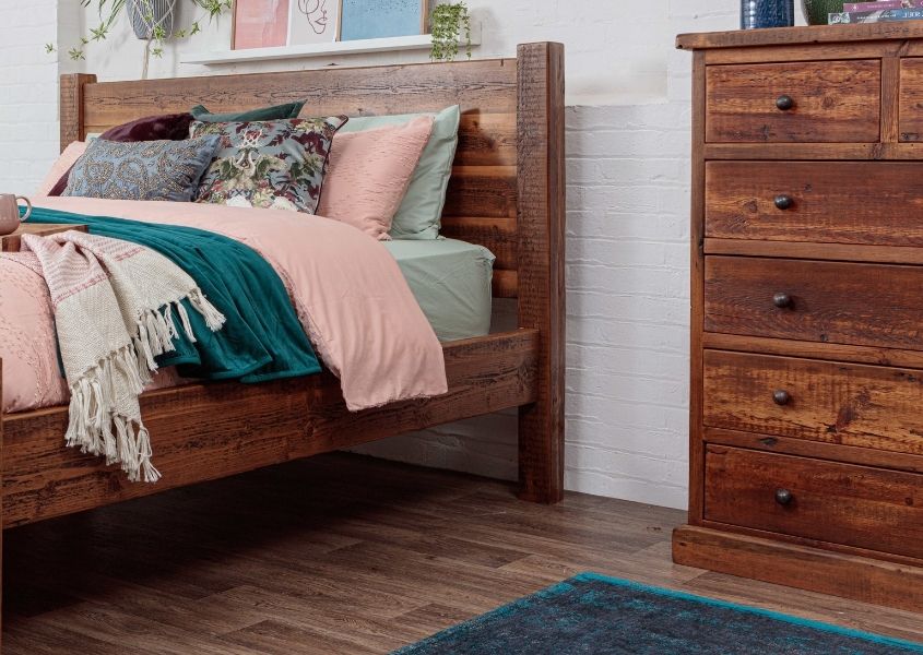 reclaimed wood bed frame and rustic chest of drawers