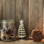 Collection of Christmas ornaments against rustic wood background