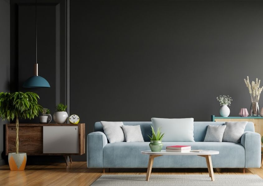 Dark grey living room with grey fabric sofa