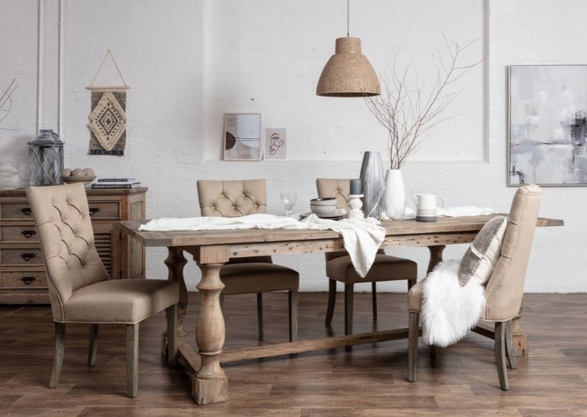 reclaimed wood dining table with cream upholstered dining chairs