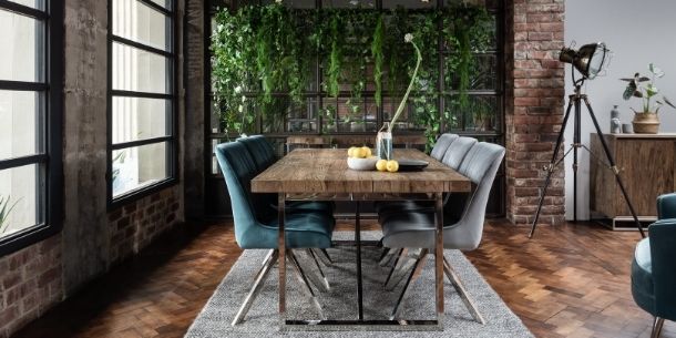 industrial dining table with grey and blue velvet dining chairs