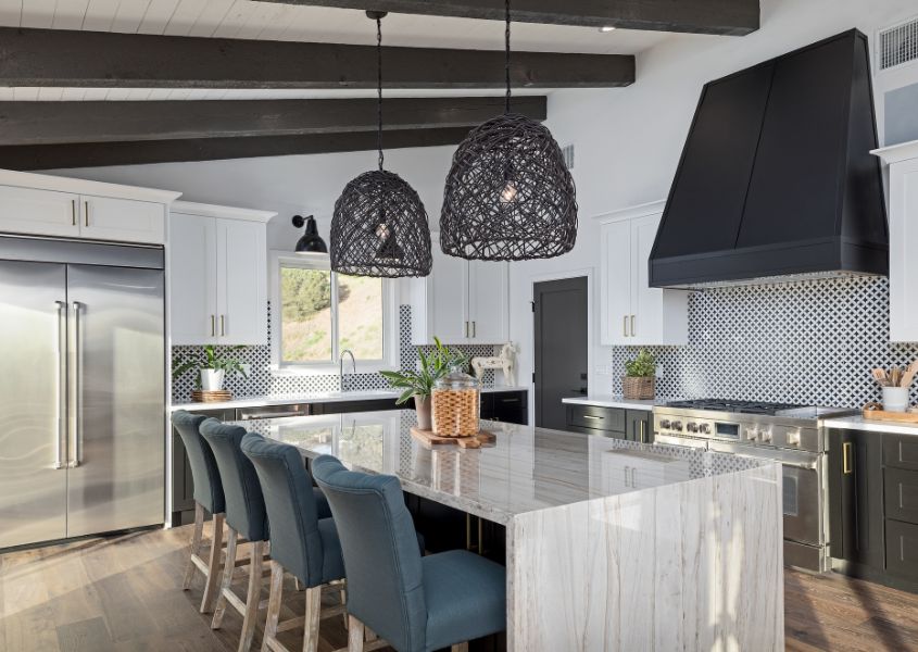 white marble kitchen island with large black rattan pendant light for how to get the wow factor in your home blog