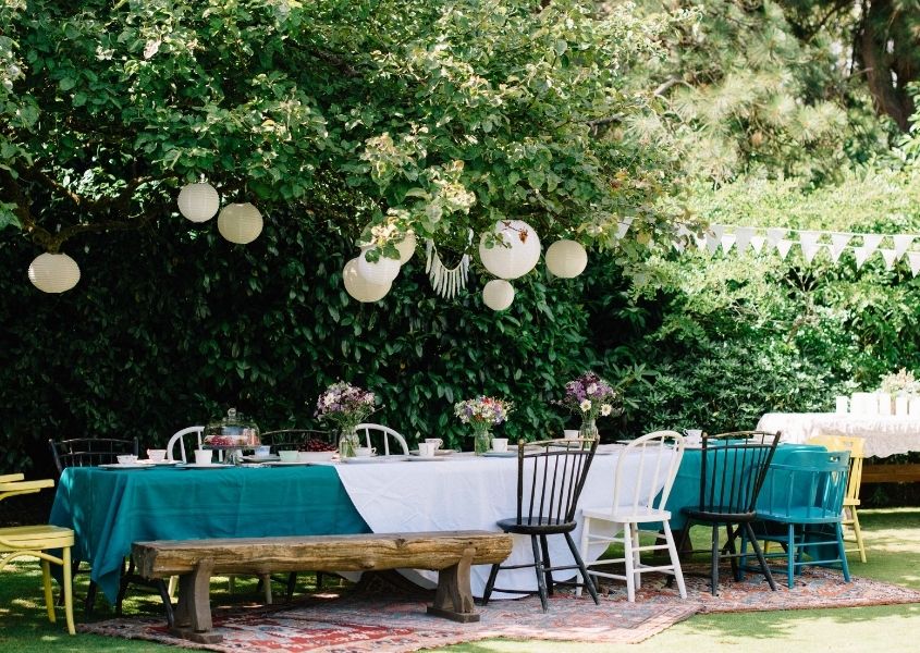 outdoor dining table with festoon lighting for how to host outdoors in style this summer blog