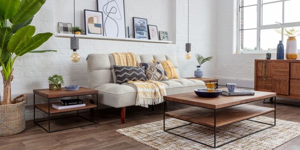 Cream sofa bed with industrial coffee table
