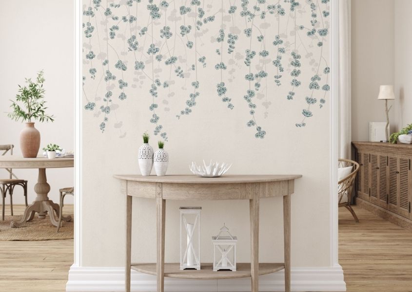 wooden console table against pillar with blossom wallpaper